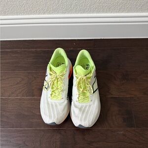 New Balance White and Green Athletic Shoes with Modern Design